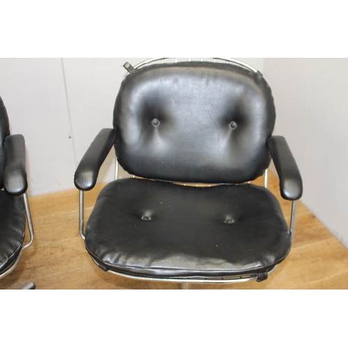 263 - Set of four chrome deep buttoned leather upholstered swivel chairs {85 cm H x 57 cm W x 42 cm D}.