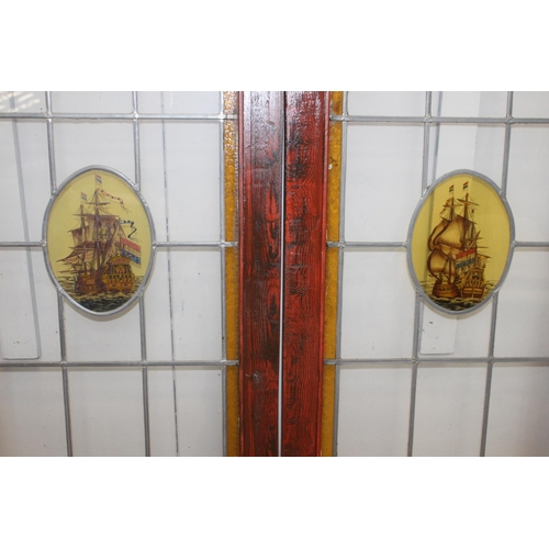 268 - Pair of leaded stain glass windows with Ship motif {140 cm H x 51 cm W x 3 cm D}.