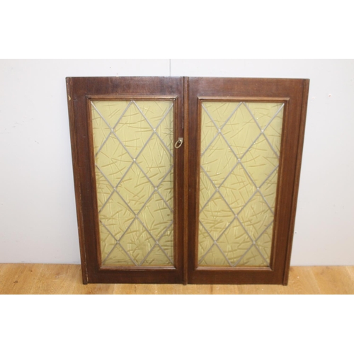 269 - Pair of leaded stain glass windows {95 cm H x 48 cm W x 2 cm D}.