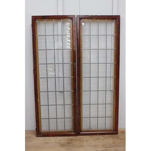 270 - Pair of leaded stain glass windows {180 cm H x 63 cm W x 4 cm D}.