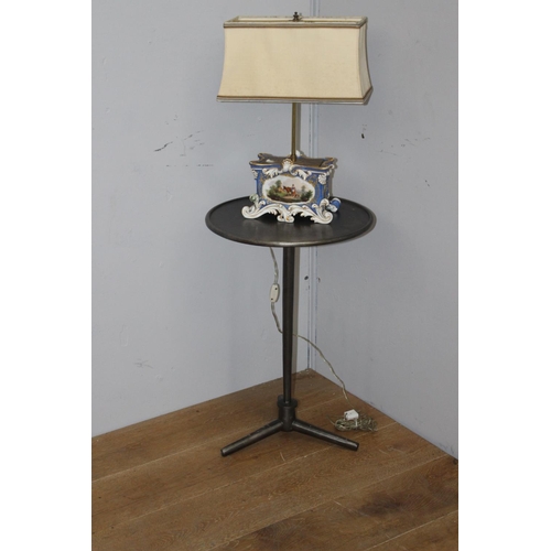 273 - Brushed bronze aluminium lamp table raised on three splayed feet {60 cm H x 39 cm Dia.}.