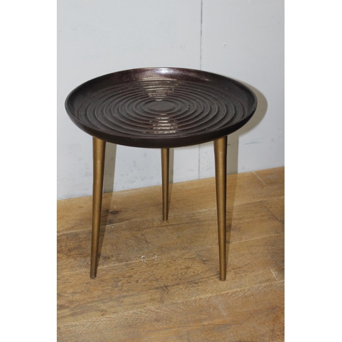 284 - Pair of aluminium ribbed top side tables {46 cm H x 45 cm Dia.}.