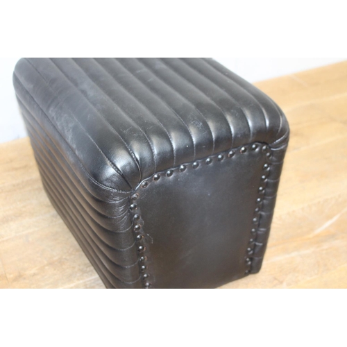 297 - Pair of black leather ribbed stools {38 cm H x 38 cm W x 36 cm D}.