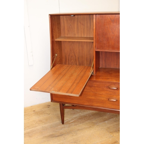 299 - Mid-century teak G Plan side board the two short doors flanked by a fall front door  above two long ... 