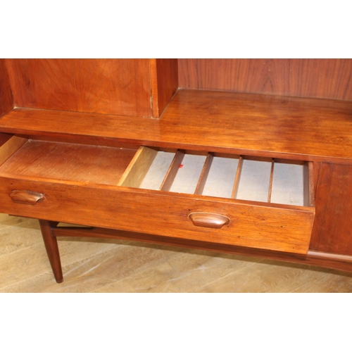 299 - Mid-century teak G Plan side board the two short doors flanked by a fall front door  above two long ... 
