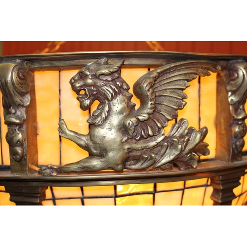 301 - Bronze and opaque glass hanging centre light decorated with Pegasus. { 65 cm H x 79 cm Diam}.