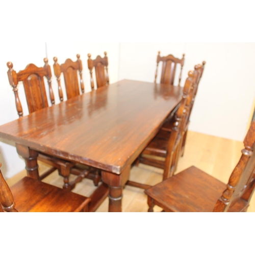 314 - Solid oak Refectory table raised on turned legs and single square stretcher with eight matching oak ... 