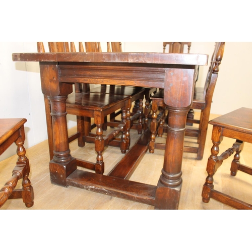 314 - Solid oak Refectory table raised on turned legs and single square stretcher with eight matching oak ... 