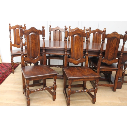 314 - Solid oak Refectory table raised on turned legs and single square stretcher with eight matching oak ... 