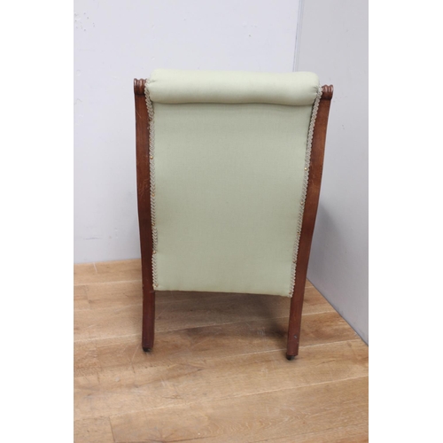 315 - Mahogany button backed upholstered nursing chair raised on turned leg and brass castors {84 cm H x 6... 