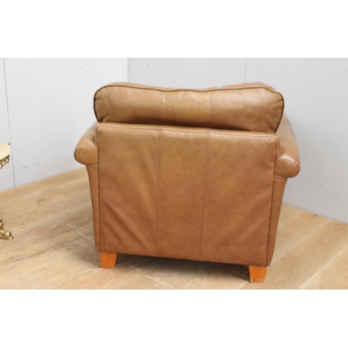 316 - Tan leather upholstered club chair with removable cushions {80 cm H x 98 cm W x 66 cm D}.