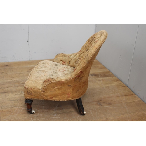 319 - Deep buttoned upholstered nursing chair rasied on turned legs and ceramic casters {76 cm H x 60 cm W... 