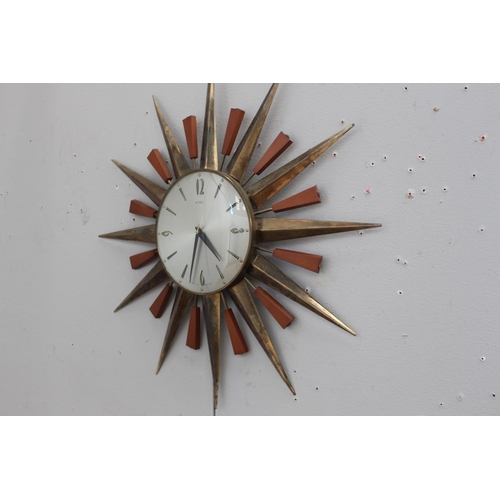 323 - Retro metal and wood sunburst clock {60 cm Dia.}.