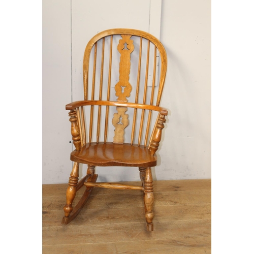 347 - Oak Windsor rocking chair {100 cm H x 53 cm W x 40 cm D}.