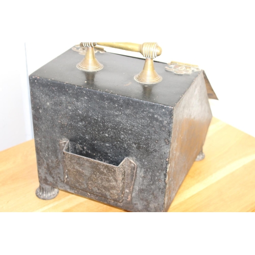 353 - Metal and brass coal scuttle decorated with flowers {37 cm H x 29 cm W x 40 cm D}.