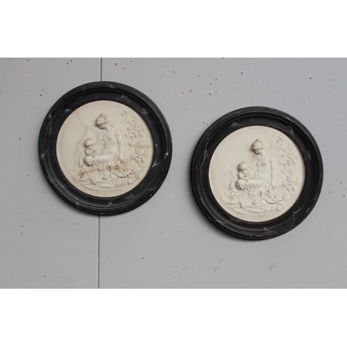 358 - Pair of marble wall plaques {40 cm Dia.}.