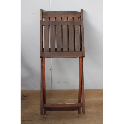 359 - Set of four oak folding garden chairs {90 cm H x 43 cm W x 50 cm D}.