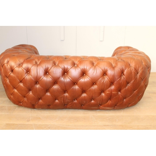 36 - Deep buttoned leather upholstered Chesterfield sofa {70 cm H x 200 cm W x 65 cm D}.