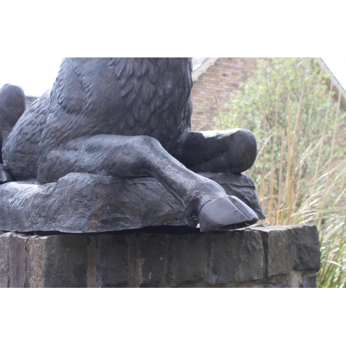 364 - Pair of bronze models of seated Stags {190 cm H x 200 cm W x 60 cm D}.