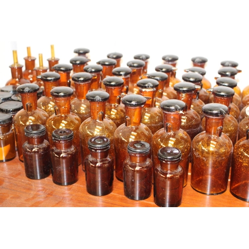 365 - Collection of eighty Chemist bottles with stoppers  {Larges 12 cm H x 5 cm Dia. and Smallest 7 cm H ... 