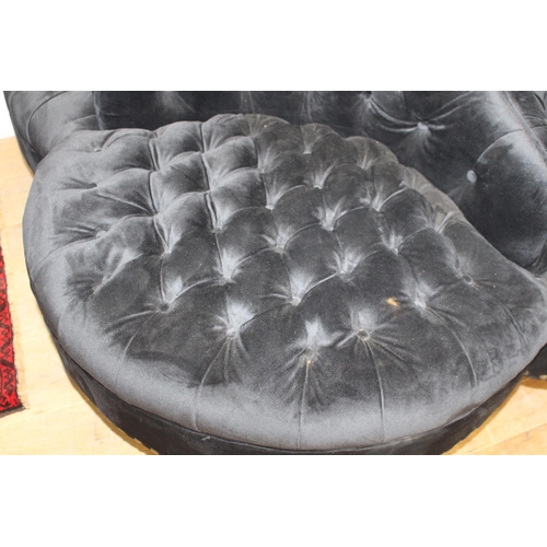 373 - Black velvet deep buttoned upholstered four seat conversation seat {100 cm H x 170 cm Dia.}.