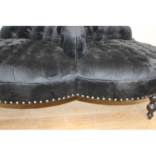 373 - Black velvet deep buttoned upholstered four seat conversation seat {100 cm H x 170 cm Dia.}.