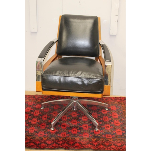 374 - Teak and chrome leather upholstered swivel chair {85 cm H x 60 cm W x 48 cm D}.