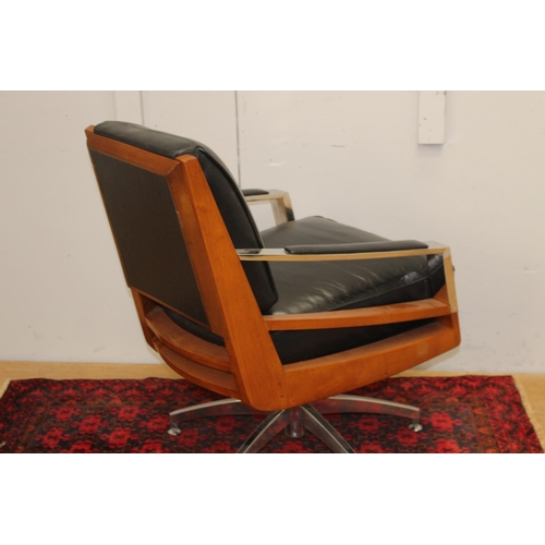 374 - Teak and chrome leather upholstered swivel chair {85 cm H x 60 cm W x 48 cm D}.