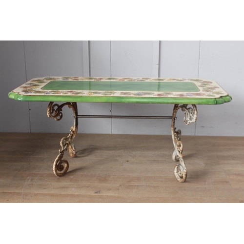 38 - Handmade and hand painted ceramic table raised on cast iron base {79 cm H x 200 cm W x 92 cm D}.