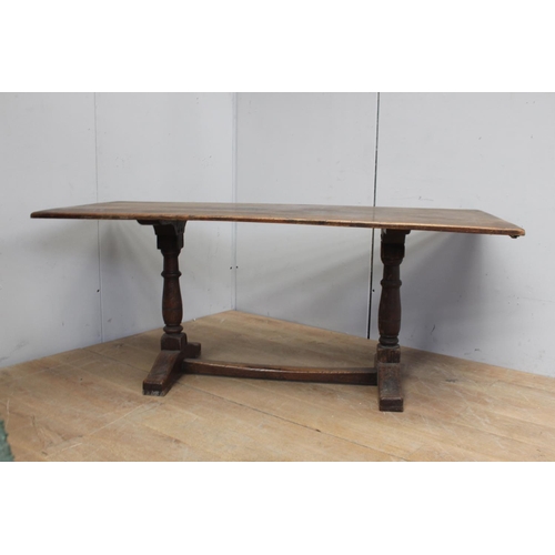 861 - Oak refectory table raised on turned supports and square stretcher { 75cm H X 182cm W X 84cm D }.