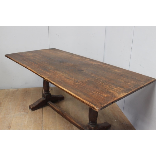 861 - Oak refectory table raised on turned supports and square stretcher { 75cm H X 182cm W X 84cm D }.
