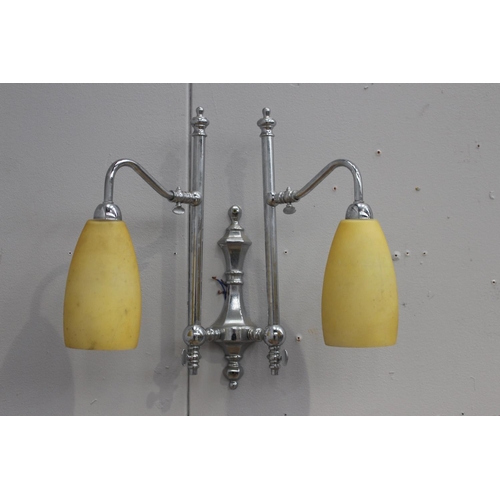 93 - Pair of chrome wall lights with yellow shades {46 cm H x 48 cm W x 22 cm D}.