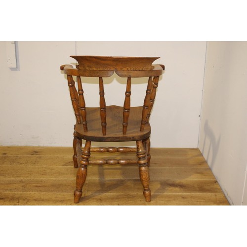 206 - Oak Captain's chair {88 cm H x 65 cm W x 49 cm D}.