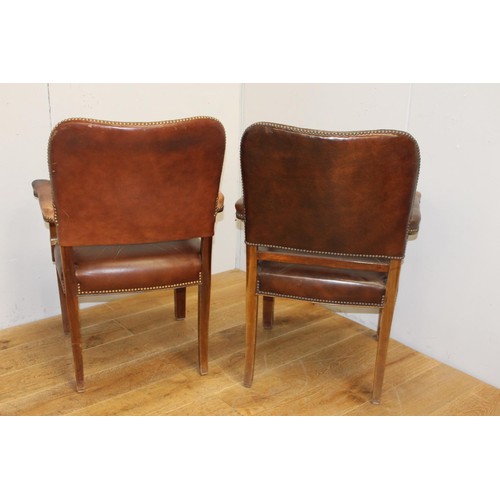 208 - Pair of wooden and leather upholstered studded armchairs {87 cm H x 59 cm W x 47 cm D}.