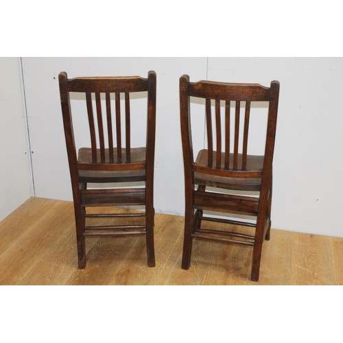 229 - Pair of oak ecclesiastical chairs {89 cm H x 38 cm W x 35 cm D}.