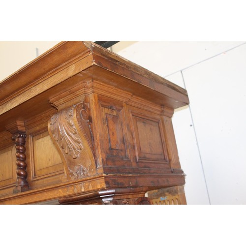 236 - Oak chimney piece decorated  with Corinthian columns {214 cm H x 184 cm W x 71 cm D}.