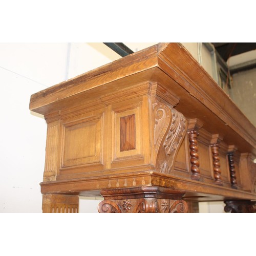 236 - Oak chimney piece decorated  with Corinthian columns {214 cm H x 184 cm W x 71 cm D}.