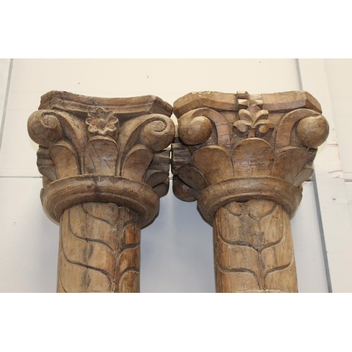 241 - Pair of Corinthian top pillars mounted on stone base {240 cm H x 58 cm W x 28 cm D}.