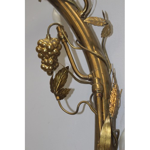 242 - Brass wedding arch with lights decorated with grapes and flowers {220 cm H x 90 cm W x 10 cm D}.