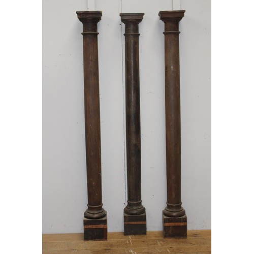 243 - Set of three pine columns {212 cm H x 22 cm W x 10 cm D}.