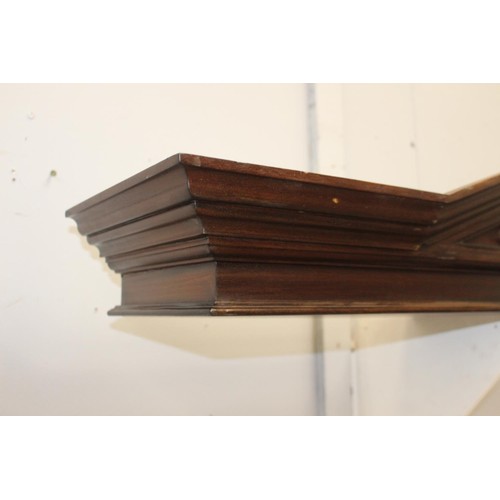 249 - Carved mahogany pediment with floral design {36 cm H x 136 cm W x 33 cm D}.