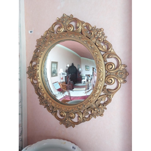 1013 - Decorative carved giltwood convex wall mirror in the 19th. C.  style {85 cm Dia.}.