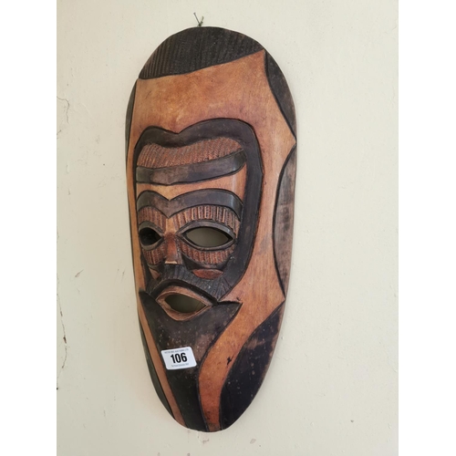 106 - Two African wooden masks { 44cm H X 24cm W & 52cm H X 27cm W }.