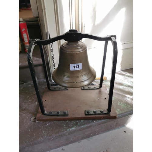 112 - Unusual 19th. C. brass and metal wall bell. { Bell 20cm Dia Frame 23cm H X 31cm W X 17cm D }.