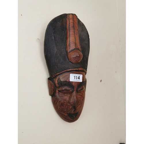 114 - Two Polynesian face masks { 56cm H X 17cm W  & 43cm H X 17cm W approx  }.