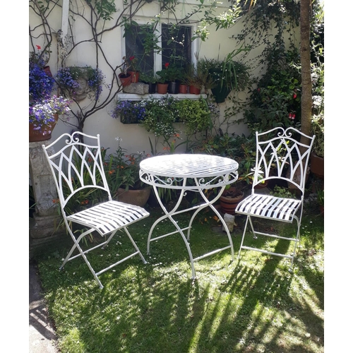 13 - Decorative cast iron three piece garden - round table with two folding white chairs {Table 71 cm Dia... 