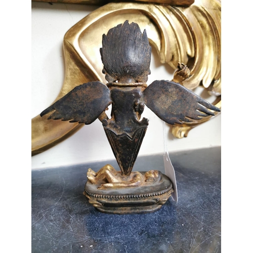 138 - Gilded metal Indian winged Deity mounted on Lotus Flower bed. { 19cm H X 18cm W X 6cm D }.