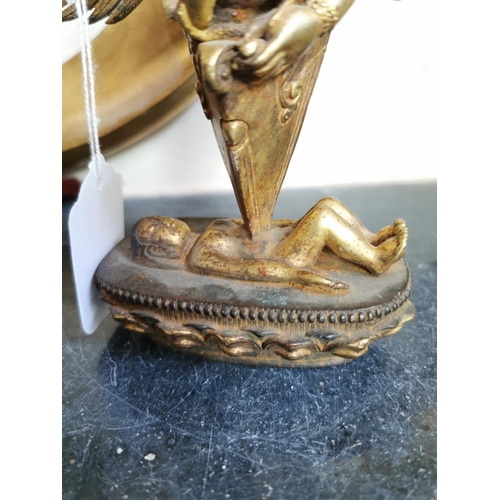 138 - Gilded metal Indian winged Deity mounted on Lotus Flower bed. { 19cm H X 18cm W X 6cm D }.