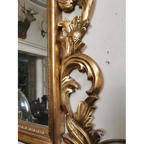 140 - Good quality carved giltwood overmantel mirror in the Rocco manner {260 cm H x 135 cm W}.