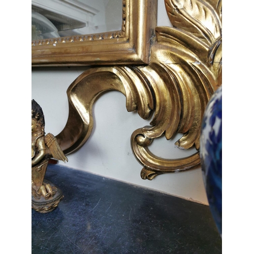 140 - Good quality carved giltwood overmantel mirror in the Rocco manner {260 cm H x 135 cm W}.